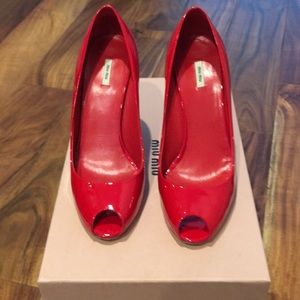 Miu Miu red patent wedge